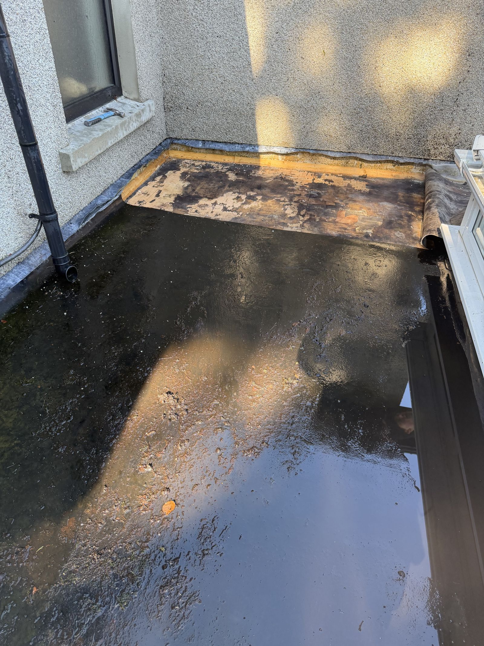 Before — failed, ponding roof